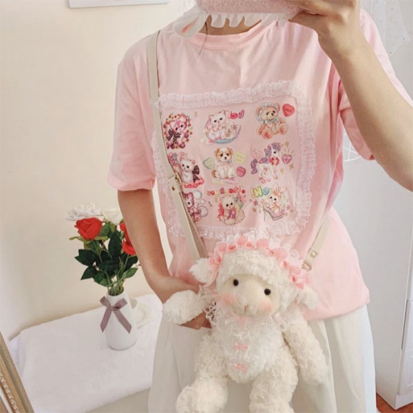Vaaleanpunainen kissakuvioinen T-paita röyhelöreunuksella